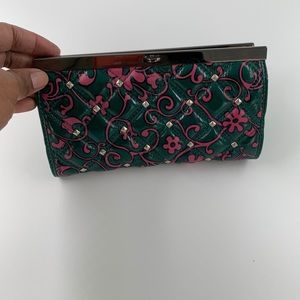Small green and pink clutch bag